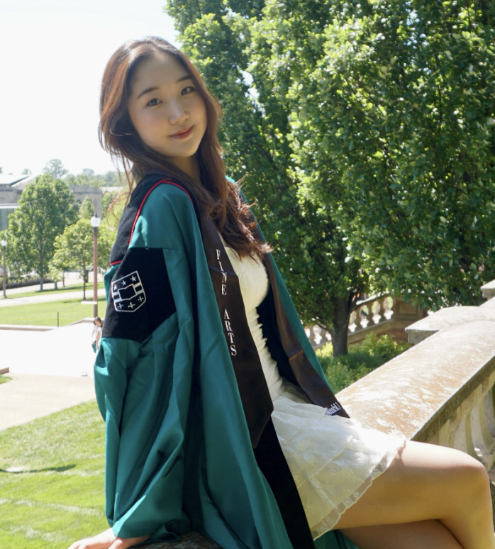 Portrait of the designer in graduation regalia